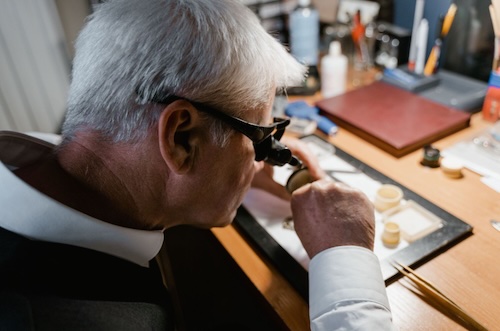 Jeweler assessing diamonds