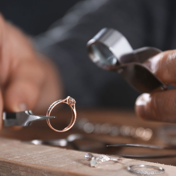 Jeweler Inspecting Ring with Loop